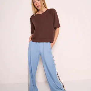Pantaloni palazzo azzurri con bande laterali